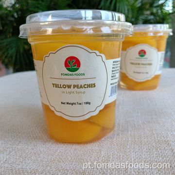 Fatias de pêssego amarelo em suco natural 198g